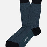 Blenheim Birdseye Merino Wool Socks in navy blue and black with a patterned design and solid cuffs, heels, and toes.