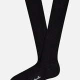 A pair of PANTHERELLA Laburnum Long 5x3 Rib Socks, black and ribbed with "Pantherella" embroidered in white near the toe, shown on a plain white background.