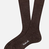 A pair of brown Laburnum Short 5x3 Rib Socks by PANTHERELLA, made from Merino wool with the brand embroidered in white on one sole, crafted in England and shown on a plain white background.