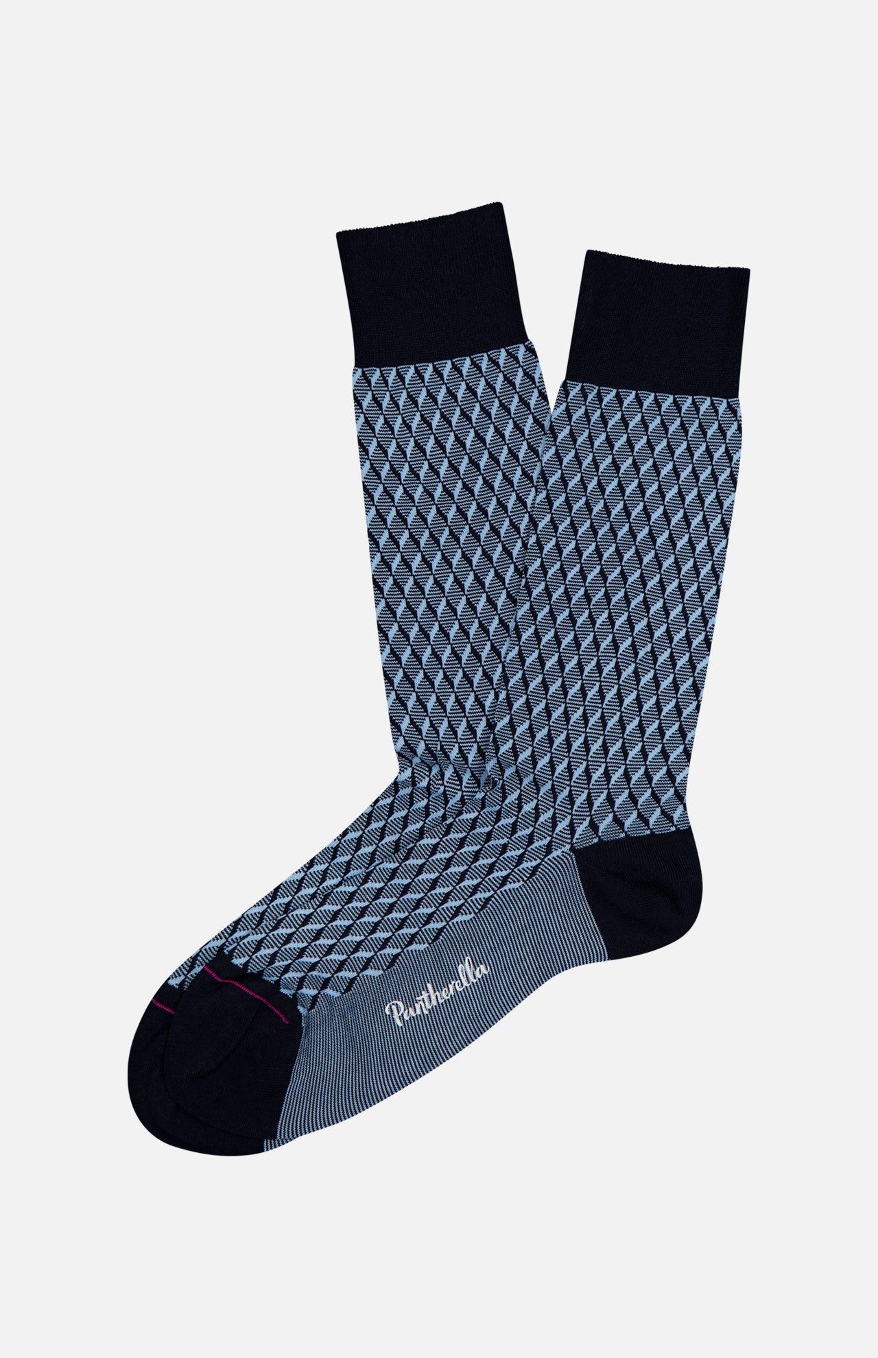 The Vaughan Patterned Sock by PANTHERELLA is a blue dress sock featuring navy diamond-shaped geometric patterns, black heels, toes, and cuffs, plus a small white logo on the sole, shown on a plain white background.