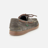 The Paraboot Barth Bateaux Boat Loafer is shown in grey suede with a tan rubber sole, brown leather laces, and visible stitching—highlighting classic hand-stitched craftsmanship from a back and side angle.