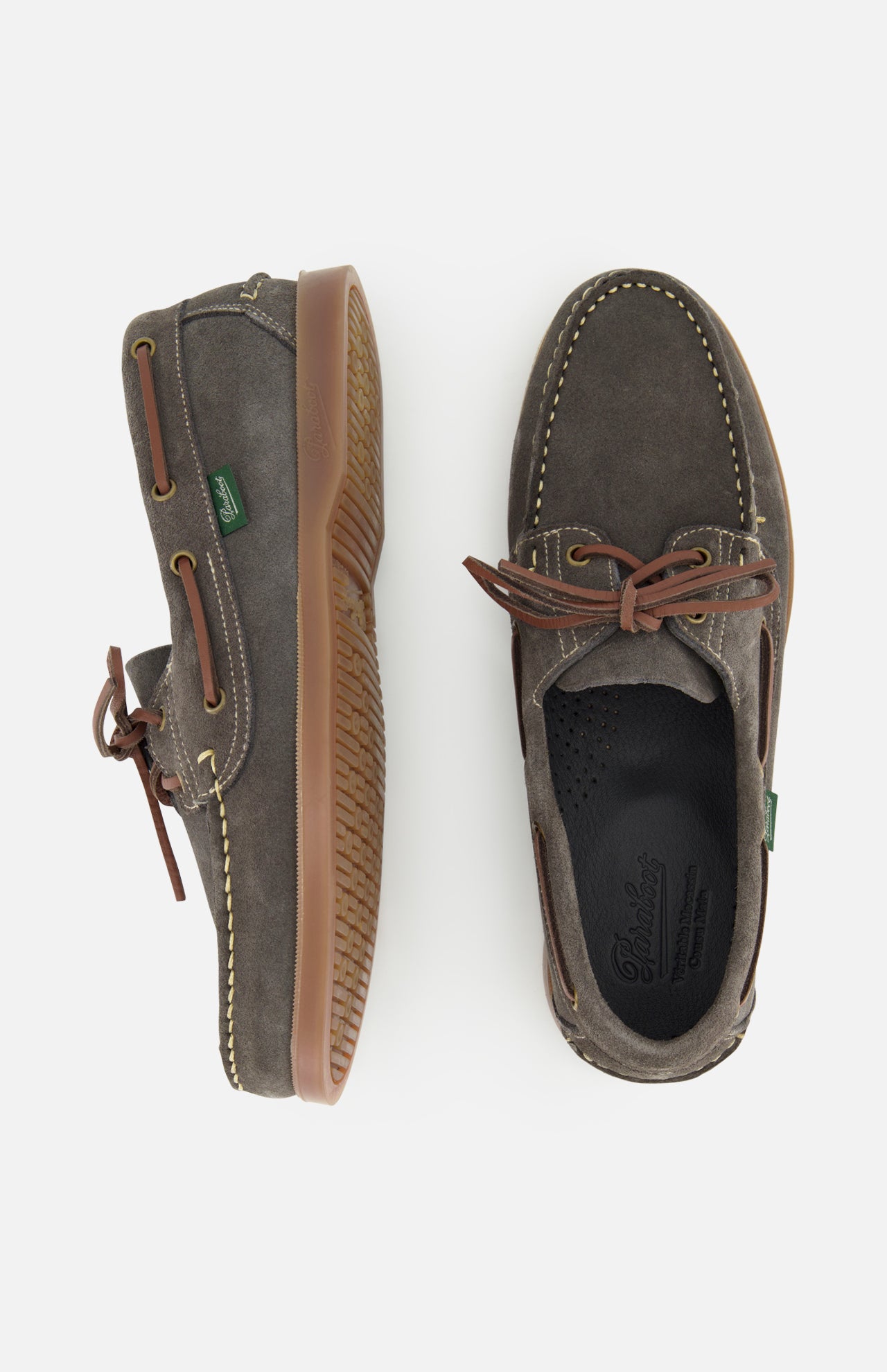 The Paraboot Barth Bateaux Boat Loafer is shown in brown suede with Norwegian welt construction and leather laces; one shoe is upright, the other on its side revealing the textured tan rubber sole.