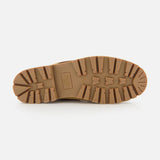 A close-up of the tan rubber outsole of the Paraboot Briac Suede Lace Loafers, featuring deep, rugged treads for traction and durability with Norwegian welt construction, shown on a white background.