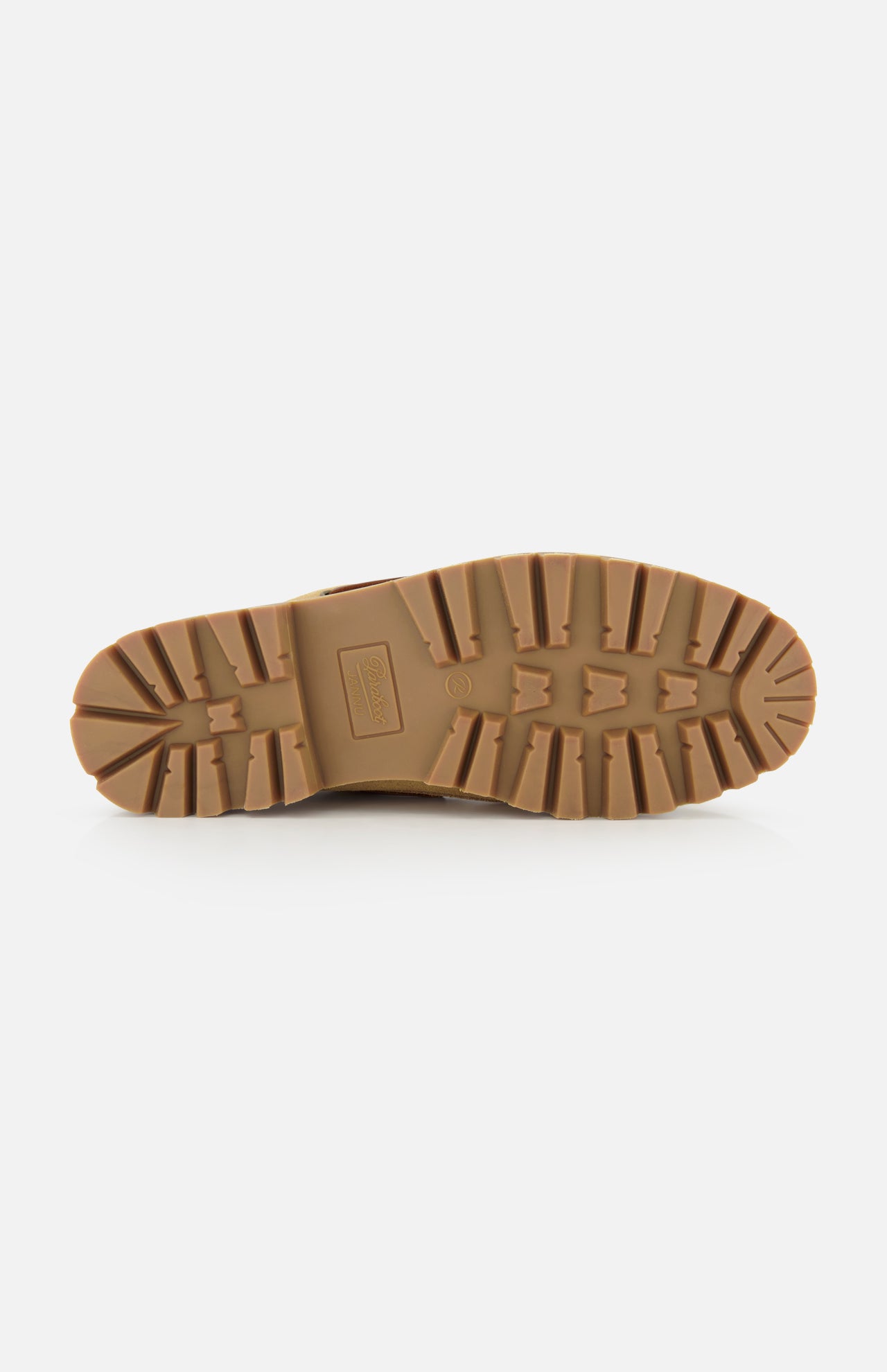 A close-up of the tan rubber outsole of the Paraboot Briac Suede Lace Loafers, featuring deep, rugged treads for traction and durability with Norwegian welt construction, shown on a white background.