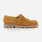 The Michael Derby Lace Loafer by Paraboot features tan suede, visible stitching, a lace-up front, low heel, and a thick textured beige rubber sole.