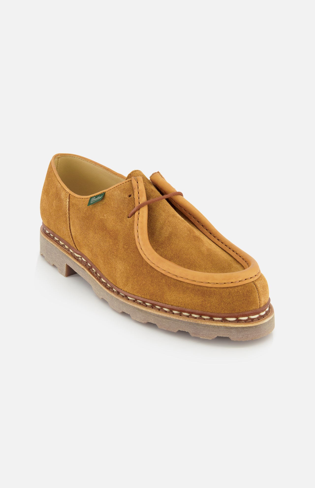 The Paraboot Michael Derby Lace Loafer features tan suede, a thick ridged rubber sole, visible white stitching, leather piping, and lace-up front with Norwegian welt construction—made in France and shown on a plain white background.