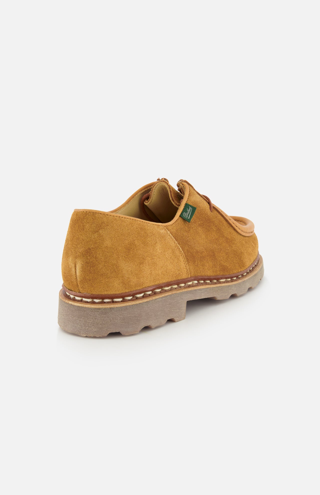 The Paraboot Michael Derby Lace Loafer features tan suede, brown stitching, a thick beige sole, Norwegian welt construction, and a small green side tag, shown from the rear and angled against a white background.