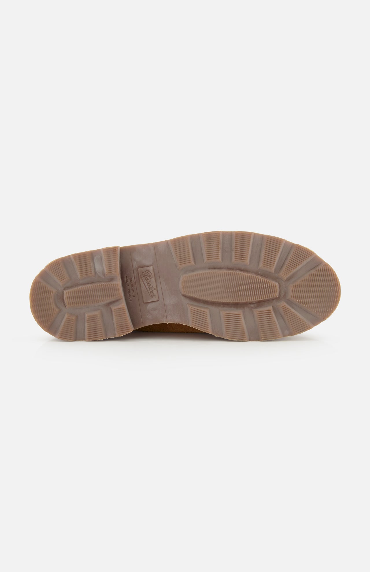 The image displays the brown rubber sole of the Paraboot Michael Derby Lace Loafer, showing multiple tread patterns for grip and traction against a plain white background.