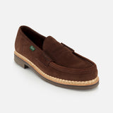 The Paraboot Nantes Slip On Loafer is a brown suede shoe with a low heel, visible stitching, Norwegian welt construction, a decorative upper strap, and a light tan welt, shown against a plain white background.