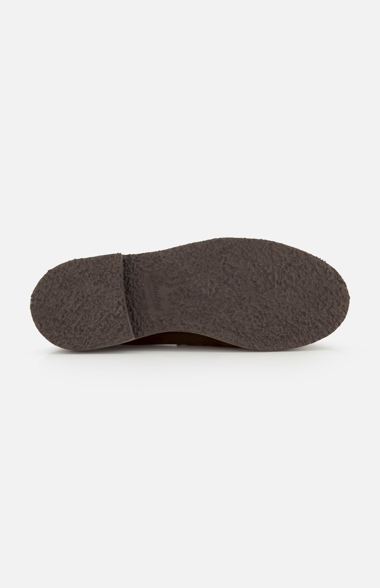 The image shows the bottom view of a dark brown textured sole from the Nantes Slip On Loafer by Paraboot, photographed on a plain white background. Made in France, this rugged sole provides excellent grip and durability.