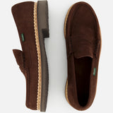 The Paraboot Nantes Slip On Loafer, in brown leather with tan rubber soles and Norwegian welt construction, is shown on a white background—one loafer from the side, the other from above.