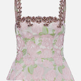 The Garden Jacquard Crystal Top by PATBO features a light pink floral jacquard design with a sleeveless silhouette and square neckline. Embellished with pink beads and delicate crystal accents along the neckline and straps, it boasts a fitted bodice and subtle peplum hem that create an elegant look—perfect for your next night out.