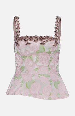 The Garden Jacquard Crystal Top by PATBO features a light pink floral jacquard design with a sleeveless silhouette and square neckline. Embellished with pink beads and delicate crystal accents along the neckline and straps, it boasts a fitted bodice and subtle peplum hem that create an elegant look—perfect for your next night out.