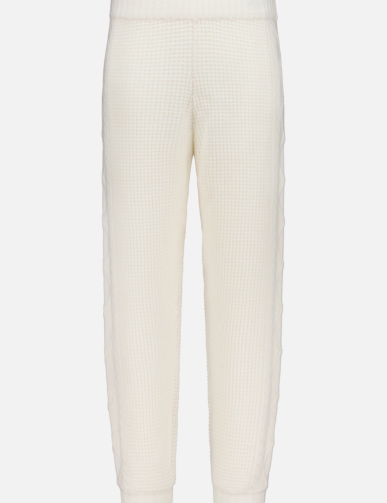 The PERFECT MOMENT Crystal Knit Jogger Pant features an off-white waffle-knit texture, elastic waistband, and ankle cuffs, offering cozy lounge style. Displayed on a plain white background.