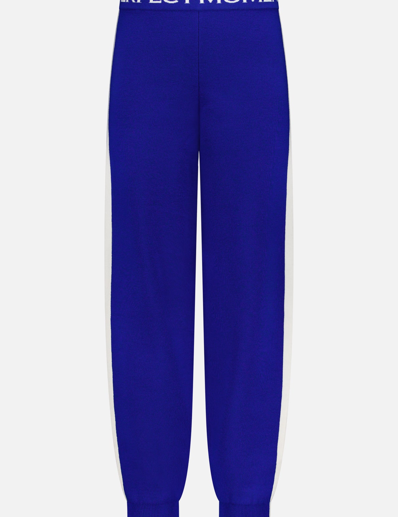 The La Tour Knitted Jogger Pant by PERFECT MOMENT features blue fabric, white side stripes, a ribbed waistband with "PERFECT MOMENT" in white lettering, and ribbed ankle cuffs for a snug après-ski fit.
