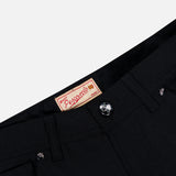 Close-up of the waistband and top front of black Nerano M Cashmere Pants featuring a silver button, belt loops, and a tan label with “PESCAROLO” in red text. Expertly crafted in Italy, these pants offer a classic 5-pocket design for both style and functionality.