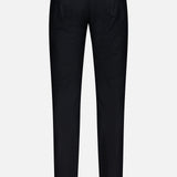 The back view of the PESCAROLO Nerano M Cashmere Pants in black showcases their slim, tailored fit. Featuring belt loops, a 5-pocket design with two back pockets, and a leather patch on the waistband, these pants are displayed against a plain white background.