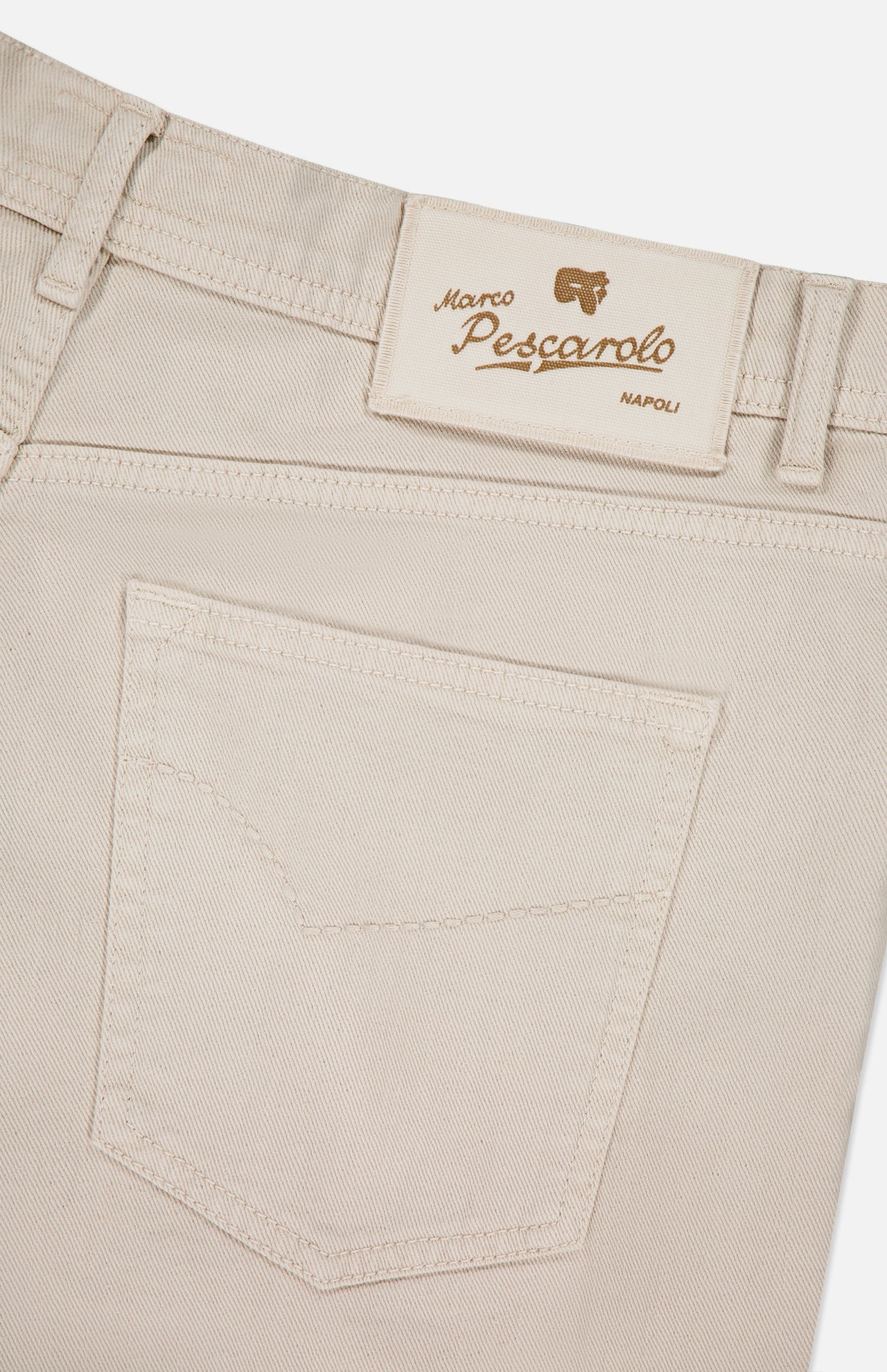 Close-up of the waistband and back pocket of the Nerano M Cotton Linen 5 Pockets Pant by PESCAROLO in light beige, featuring a tan leather patch with gold "PESCAROLO Napoli" text.