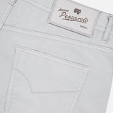 Close-up of the back of light beige PESCAROLO Nerano M Cotton Silk 5 Pockets Pant, showing a stitched pocket and a white label above the waistband with the brand name and logo.