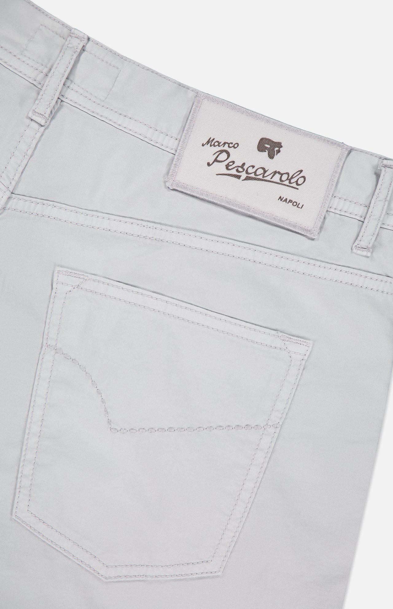 Close-up of the back of light beige PESCAROLO Nerano M Cotton Silk 5 Pockets Pant, showing a stitched pocket and a white label above the waistband with the brand name and logo.