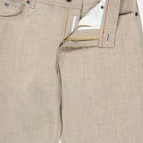 A close-up of the PESCAROLO Nerano M Flannel Pants in beige shows the fly open, revealing a silver button, zipper, and white inner lining. The waistband features an orange accent, a sewn-in label, and the classic 5-pocket design.