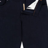 Close-up of the Nerano M Plaid Pants by PESCAROLO, with the front zipper fly partially open to reveal the interior lining and pockets. The classic 5-pocket design is featured, while orange stitching accents are visible on the waistband and fly area.