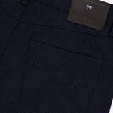 Close-up of the Nerano M Plaid Pants by PESCAROLO, featuring a classic 5-pocket design with a visible back pocket, belt loops, and a black leather patch embossed with the brand’s logo and text near the waistband.