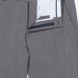 Close-up of the Charlotte Performance Trouser Pant in grey stretch mélange, with the waistband and zipper fly open to reveal a striped inner lining and a PETER MILLAR branded waistband label.