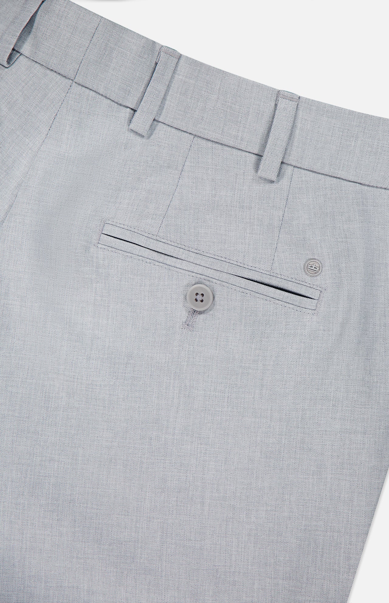 The Charlotte Performance Trouser Pant by PETER MILLAR features a light gray stretch mélange, back pocket, belt loops, single button closure, subtle woven texture, and is crafted from recycled polyester for style and comfort.