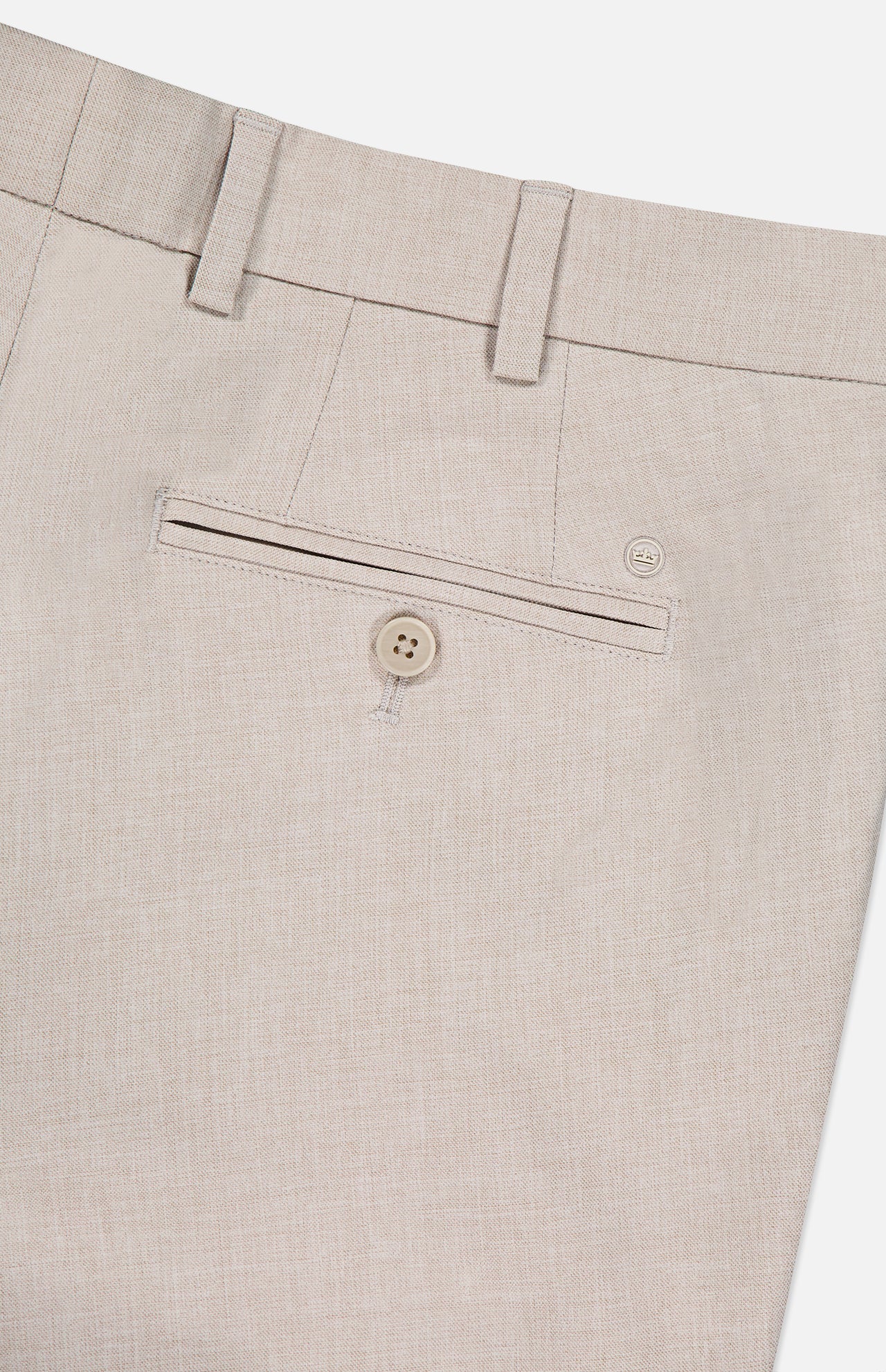 Close-up of the back of the PETER MILLAR Charlotte Performance Trouser Pant in beige stretch mélange fabric, featuring a belt loop, welt pocket with button closure, and a small embroidered logo above the pocket.