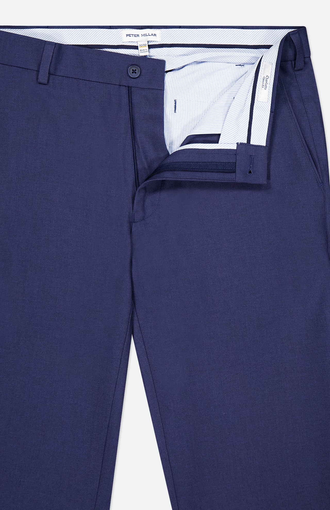 A pair of PETER MILLAR Charlotte Performance Trouser Pants in navy blue stretch mélange, shown with the front fly unzipped and waistband open to reveal the striped inner lining and button closure.