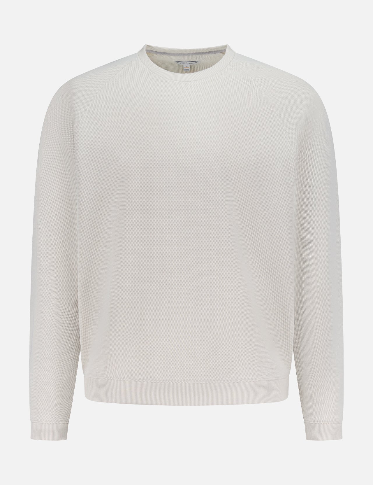 The PETER MILLAR Cradle Pique Performance Long Sleeve Sweatshirt features a relaxed fit, off-white textured piqué fabric, subtle four-way stretch, and long sleeves, shown against a white background.