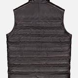 The PETER MILLAR Deerskin Leather Vest is shown from the back against a plain white background. This dark brown, sleeveless vest features padded horizontal quilting, a short stand collar, and is lined with Merino wool for added comfort—ideal for those in search of refined luxury outerwear.
