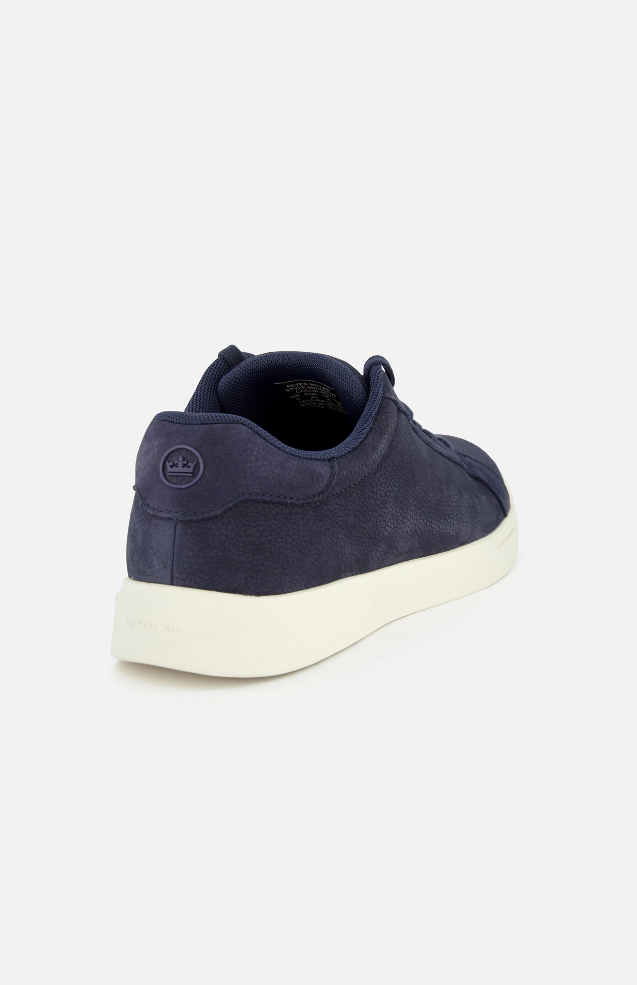 The PETER MILLAR Drift Classic Nubuck Sneaker for men features a navy upper with textured fabric, a white sole, and a small circular logo on the heel. Shown from the back left side against a plain white background.