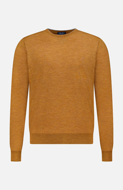 The Excursionist Flex Crewneck Sweater by PETER MILLAR is a long-sleeved, mustard yellow crew neck crafted from soft merino wool and shown against a white background—an ideal stylish travel sweater for any adventure.