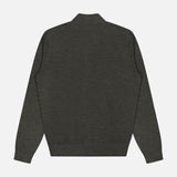 The Excursionist Flex Full Zip Sweater by PETER MILLAR is shown laid flat from the back on a white background. This dark gray merino wool sweater features long sleeves, a full zip design, ribbed hem and cuffs, and a small collar for a simple yet refined look.