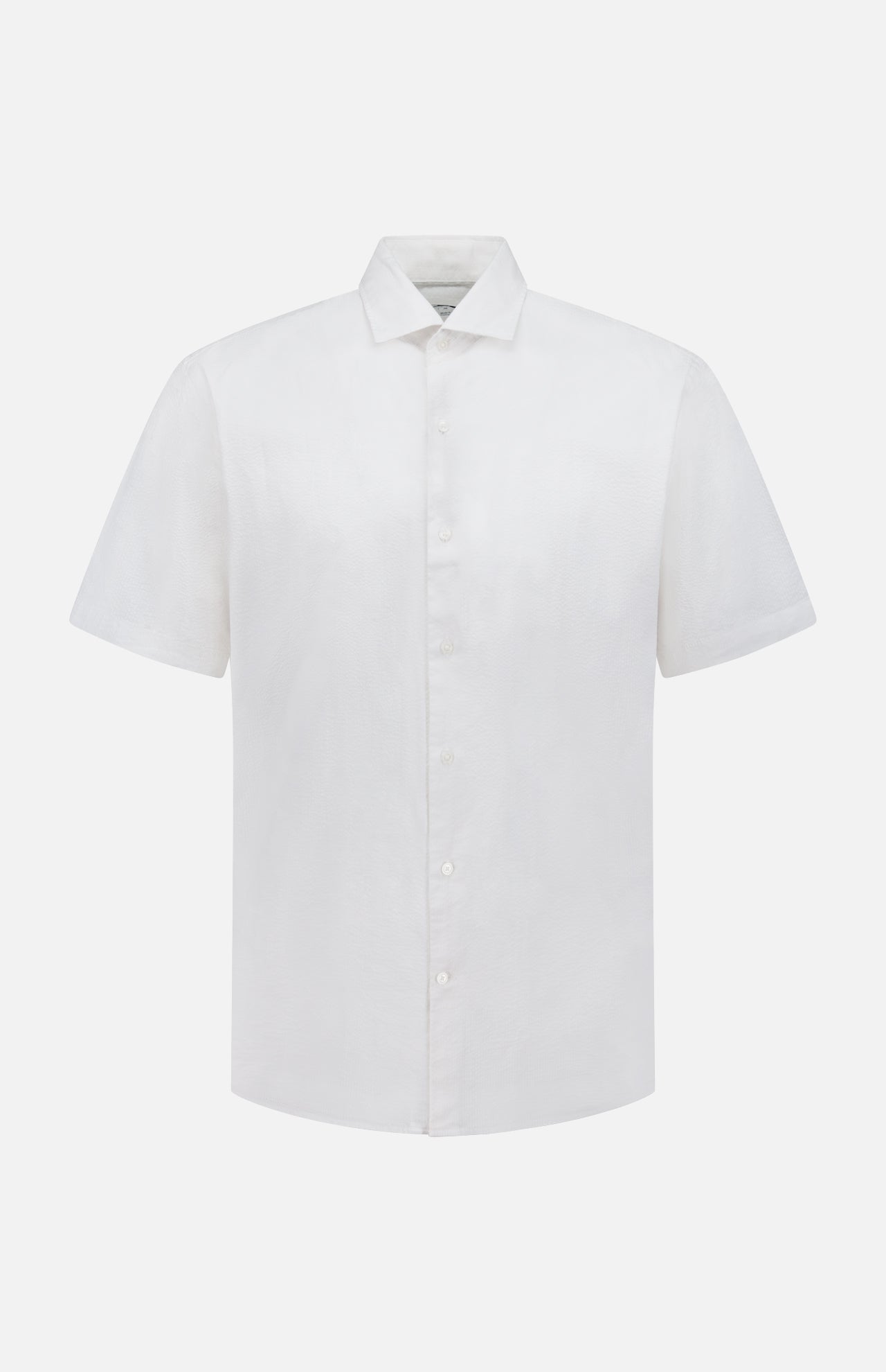 The Seaward Cotton Lyocell Sport Shirt by PETER MILLAR is a lightweight white, plain short-sleeve button-up with a classic collar, shown against a white background.