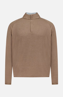 The Stealth Performance Quarter-Zip Sweater by PETER MILLAR is a light brown, long-sleeve, lightweight pullover featuring a short stand collar and a partial front zipper with a quarter-zip neckline for versatile styling, displayed against a plain white background.