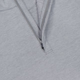 Close-up of the PETER MILLAR Stealth Stripe Performance Quarter-Zip Sweater in light gray, featuring a partially open zipper that reveals a blue tag inside the collar. The fabric showcases a subtle striped texture and offers four-way stretch for enhanced comfort and mobility.