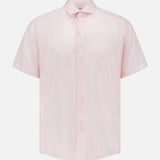 The PETER MILLAR Tamarama Cotton Lyocell Sport Shirt features short sleeves, a light pink hue, and a subtle small dotted pattern, blending classic style and comfort, shown on a plain white background.