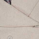 Close-up of the 3.1 PHILLIP LIM Recycled Wool Peacoat with Plaid Combo in beige, featuring large lapels, two beige buttons, plaid lining at the collar, and a visible brand label on the inner neckline.