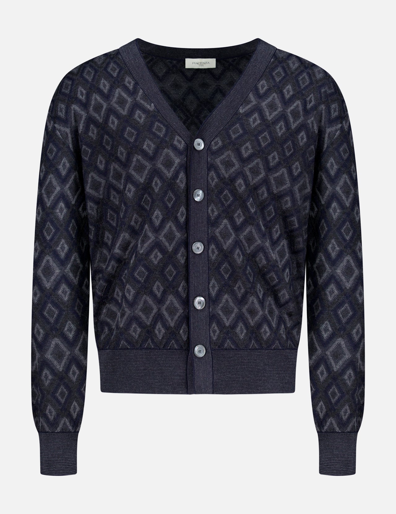 The Icon Argyle Stitch Cardigan by PIACENZA is a navy Italian wool V-neck with long sleeves, geometric diamond pattern, ribbed cuffs and hem, and five front buttons.