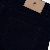 Close-up of the back pocket and waistband of the 1000 Wales Stretch Denim Jeans in dark blue, crafted from stretch-cotton denim and made in Italy, featuring a tan patch label with PT TORINO above the pocket.
