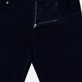 Dark navy 1000 Wales Stretch Denim Jeans by PT TORINO, featuring a stretch-cotton corduroy construction with a partially open zipper and button fly, revealing the PT TORINO branded label on the back waistband. Crafted in Italy, these jeans are displayed laid flat on a white background.