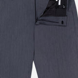 A pair of dark grey Active Superlight Wool Twill Trousers by PT TORINO with the waistband partially open, highlighting the button, zipper, and inner label details. These corporate pants blend classic sophistication with modern comfort, making them a polished wardrobe essential.