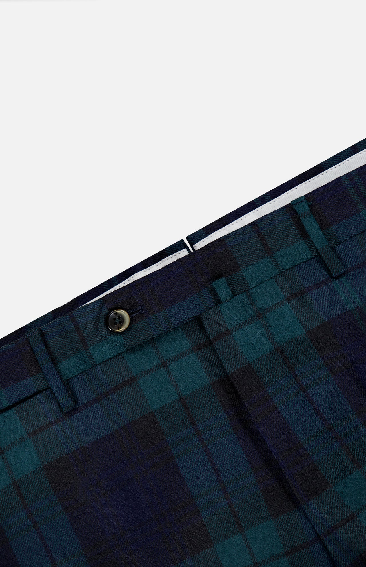 Close-up of the PT TORINO Clan Heritage Wool Tartan Trouser Pants in blue and green, featuring the waistband, belt loops, button, and part of the fly against a light gray background. These slim fit trousers showcase detailed construction that blends style and comfort with their fleece wool material.