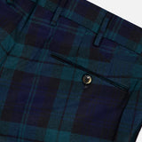 Close-up of the Clan Heritage Wool Tartan Trouser Pants by PT TORINO in a slim fit, featuring dark green and navy blue tartan pattern, with a buttoned back pocket, belt loops, and detailed waistband.