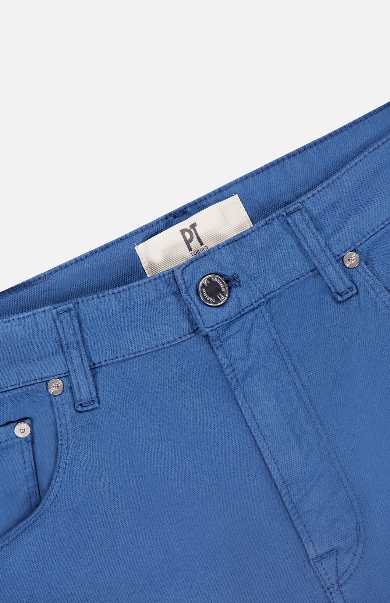 Close-up of the PT TORINO Cotton-Cashmere Stretch Tricotine Jeans in Azzurro, showcasing belt loops, a black button, and a visible white PT TORINO label near the waistband, all crafted in a classic 5-pocket design.