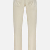 Back view of the PT TORINO Cotton & Cashmere Stretch Tricotine Jeans in Stone, featuring a classic 5-pocket design with two back pockets, straight legs, and a brown patch on the waistband. Crafted in Italy from a beige cotton-cashmere blend, these jeans are displayed against a plain white background.