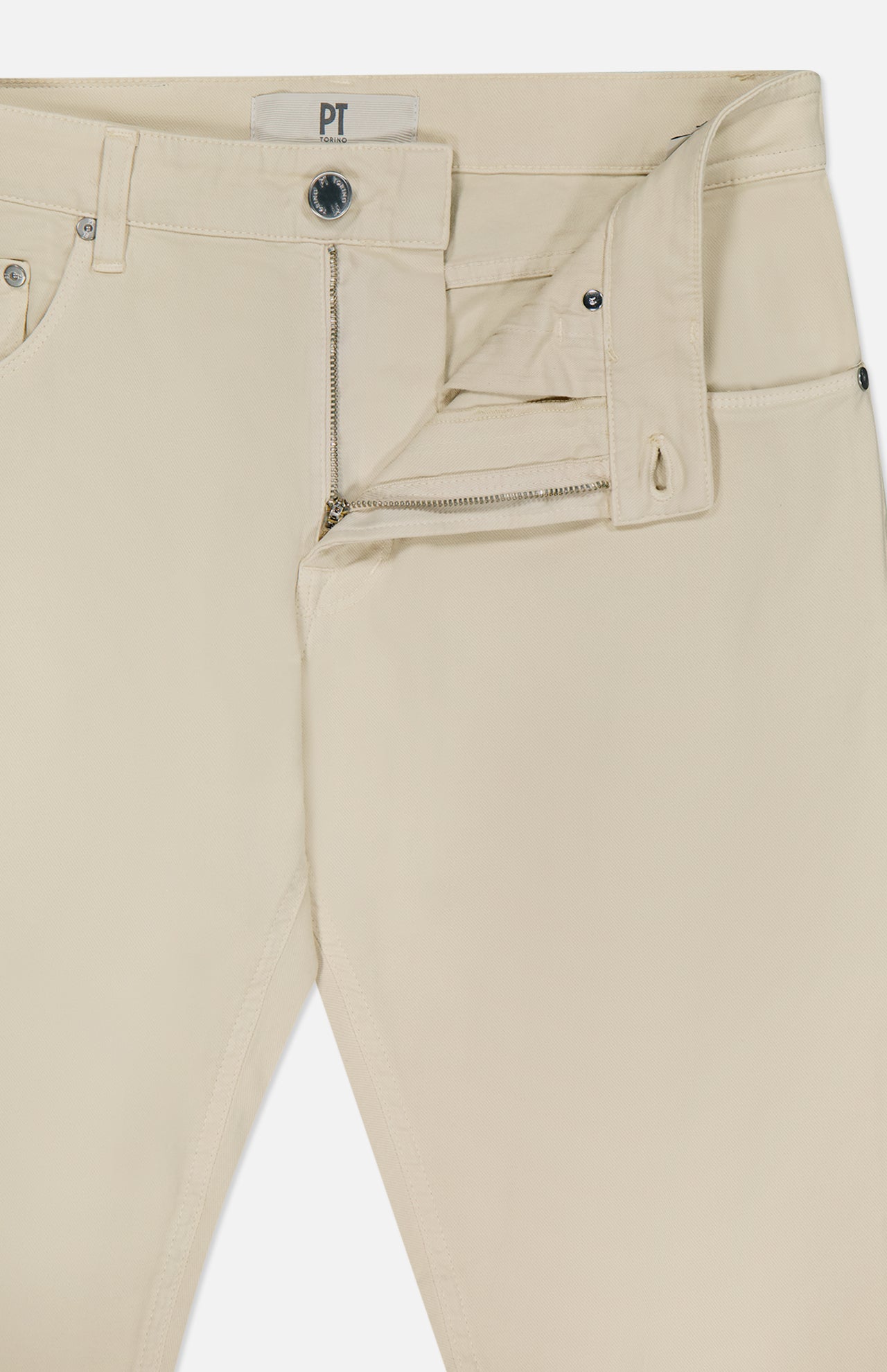 PT TORINO’s Cotton & Cashmere Stretch Tricotine Jeans in Stone showcase a visible zipper and button fly, partially unzipped to display the waistband and part of the inside label. Crafted in Italy from a luxe cotton-cashmere blend, these jeans feature a classic 5-pocket design.